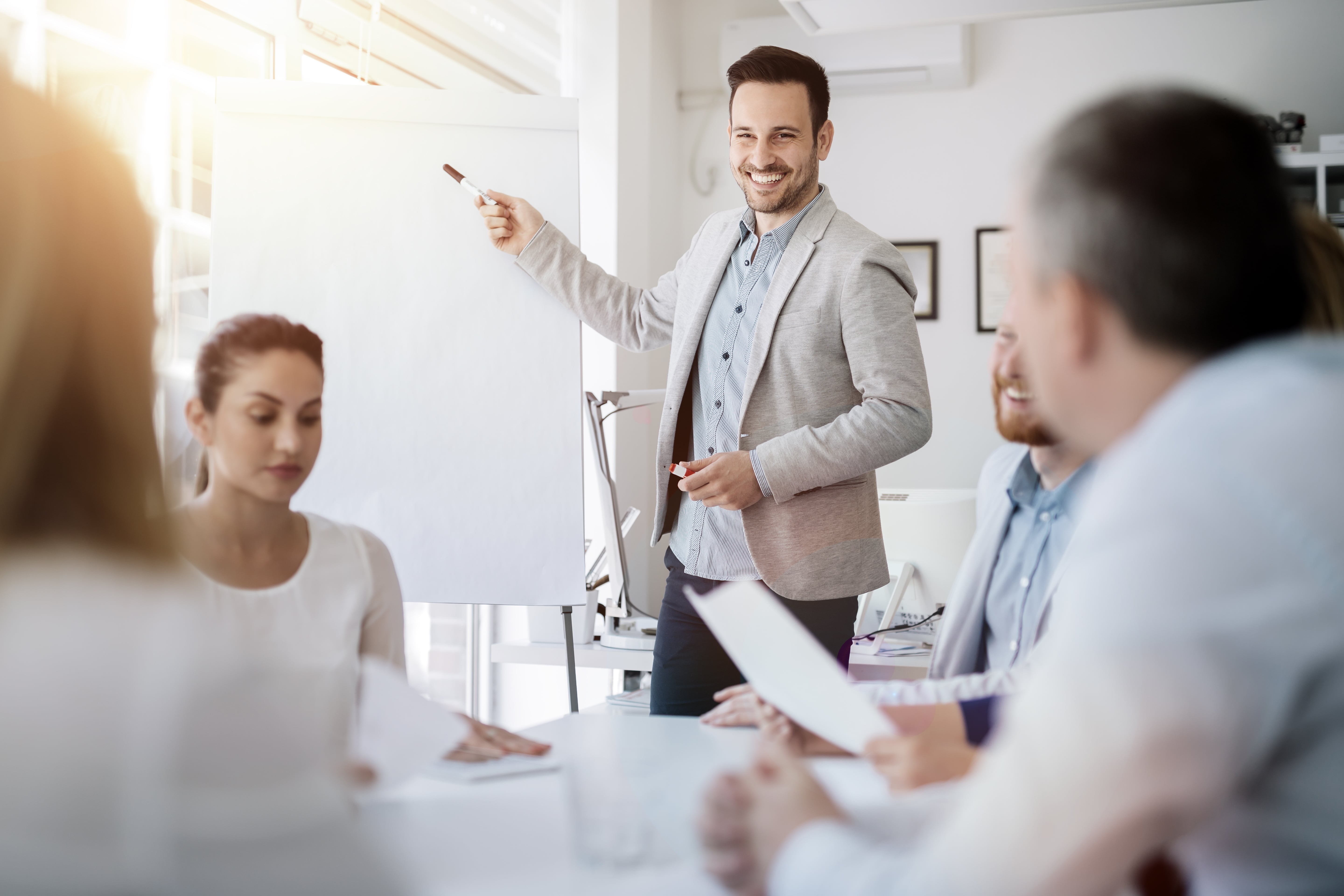 A man is giving a presentation to an audience.