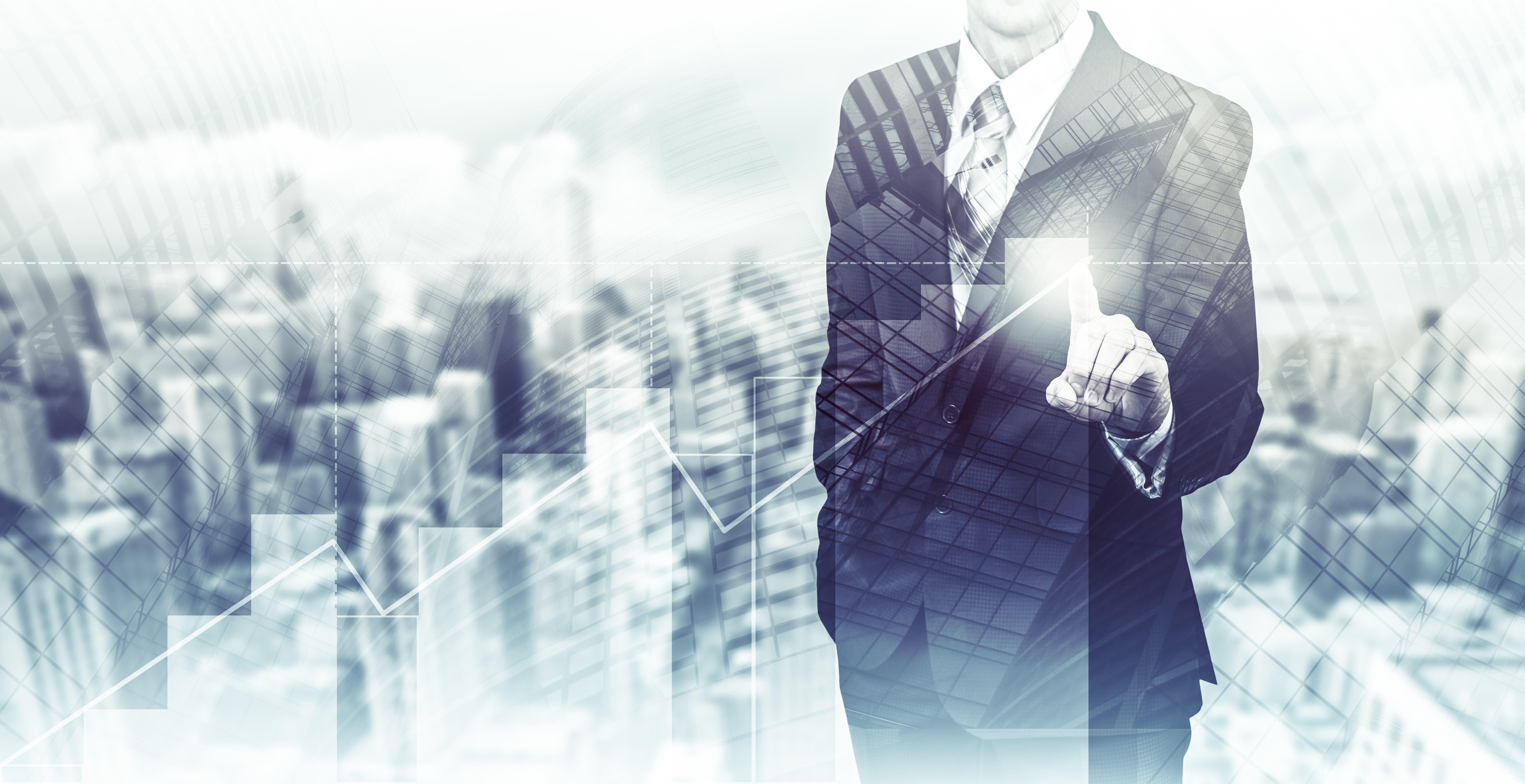 A man in a suit and tie holding a smart phone.